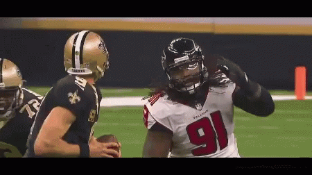 A Football Player With The Number 91 On His Jersey Is Being Tackled By Another Player GIF