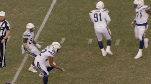a football player with the number 91 on his jersey is getting ready to kick the ball