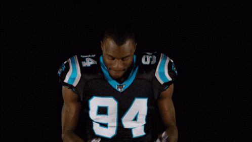 A Football Player With The Number 94 On His Shirt GIF