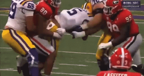 A Football Player With The Number 99 On His Shirt GIF