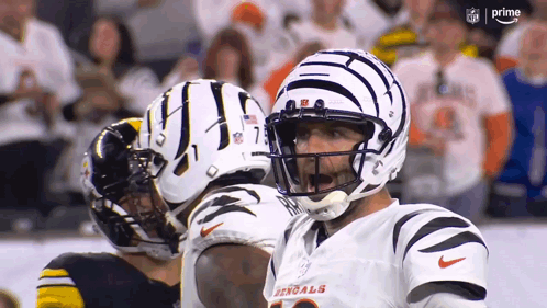 A Football Player With The Word Bengals On His Shirt GIF