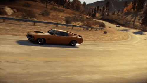 A Ford Mustang Is Driving Down A Road With Mountains In The Background GIF