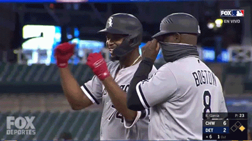 A Fox Deportes Broadcast Shows Two Baseball Players Celebrating GIF