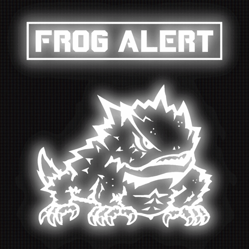 a frog is glowing in the dark under a sign that says " frog alert "