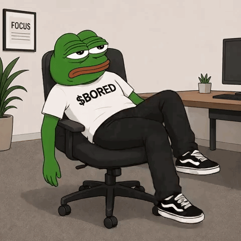 A Frog Wearing A Shirt That Says Bored Is Sitting In An Office Chair GIF