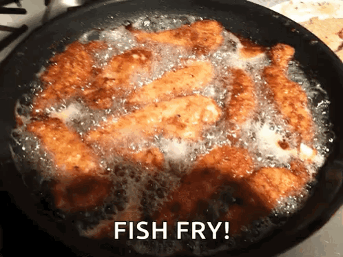 A Frying Pan Filled With Fried Fish With The Words Fish Fry Written Above It GIF