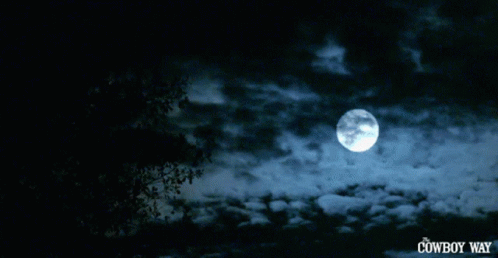 A Full Moon In A Cloudy Sky With The Cowboy Way Written On The Bottom GIF