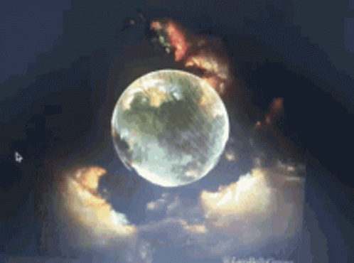 A Full Moon Is Surrounded By Clouds In The Sky GIF