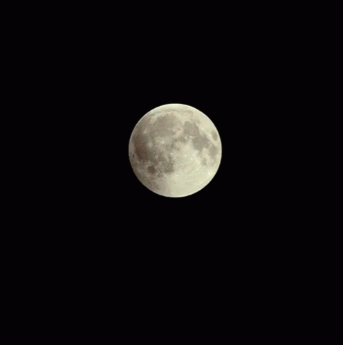 A Full Moon Is Visible In The Dark Night Sky GIF