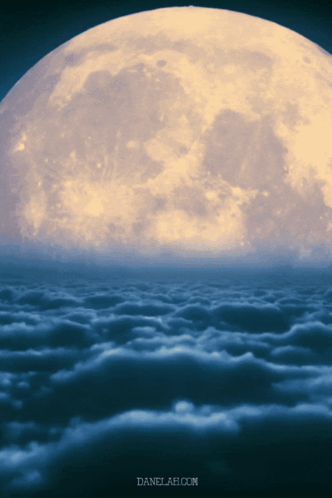 A Full Moon Is Visible Over A Cloudy Sky GIF
