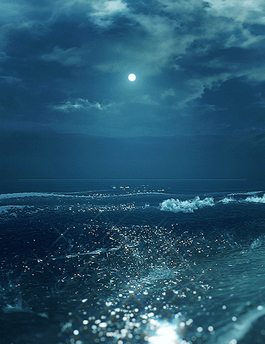 A Full Moon Shines Brightly Over A Body Of Water GIF