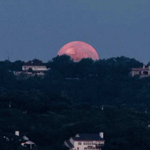 a full moon with a cartoon face on it