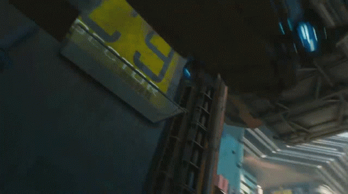 A Futuristic City With A Sign That Says St. On It GIF