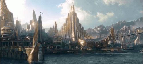 Futuristic City Surrounded By Water And Mountains GIF