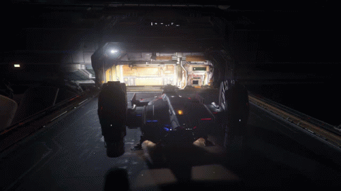 A Futuristic Vehicle Is Parked In A Dark Room With The Number 00 On The Wall GIF