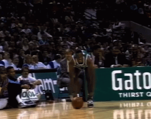 A Gatorade Ad Is On The Side Of The Court GIF