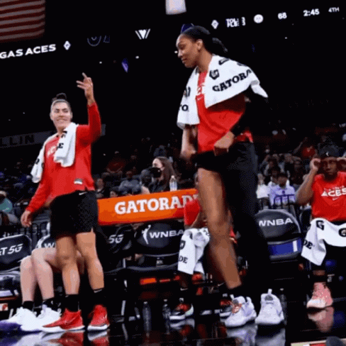 A Gatorade Banner Is Being Held Up By A Basketball Player GIF