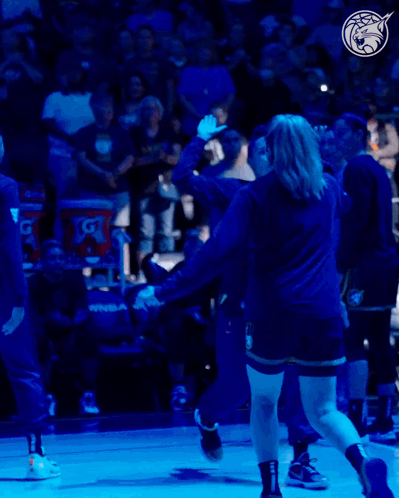A Gatorade Bucket Sits Behind A Basketball Player On The Court GIF