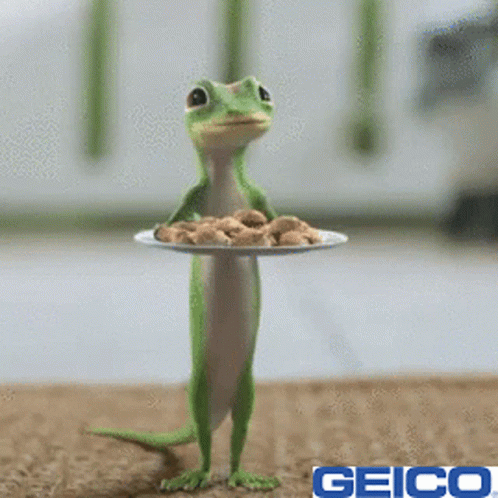 A Geico Lizard Holding A Plate Of Cookies On Its Head GIF