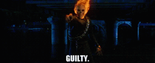 A Ghost Rider With A Chain Around His Neck Is Pointing At The Camera And Saying Guilty . GIF