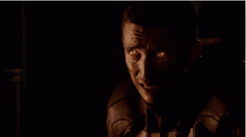 A Ghost Rider With Flames Coming Out Of His Head Is Looking At The Camera . GIF