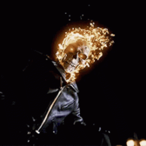 A Ghost Rider With Flames Coming Out Of Its Head GIF