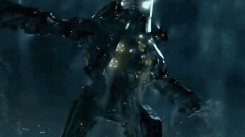 A Giant Monster With A Glowing Light Coming Out Of It 'S Mouth GIF