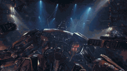 A Giant Robot With The Letter H On It 'S Head GIF