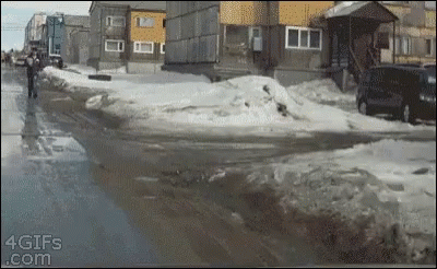A Gif From 4Gifs.com Shows A Man Walking On A Snowy Street GIF
