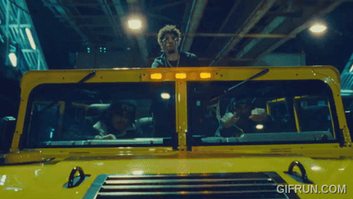 A Gif From Gifrun.com Shows A Man In A Yellow Truck GIF