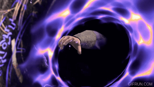 a gif from gifrun.com shows a person 's hand reaching out of a black hole