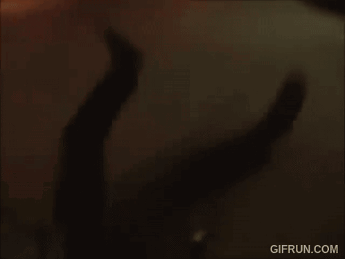 A Gif From Gifrun.com Shows A Person Walking Through A Parking Garage GIF