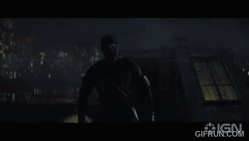 A Gif From Ign Shows A Man In A Mask In The Dark GIF