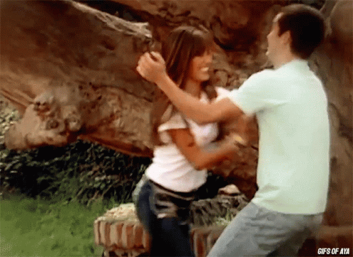 a gif of a man and a woman hugging with the words gifs of aya below them