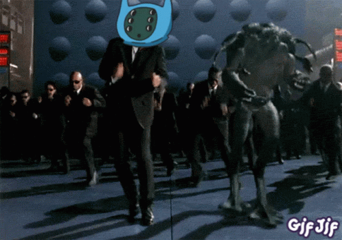 A Gif Of A Man In A Suit Dancing With A Monster And The Words Gif Jif At The Bottom GIF