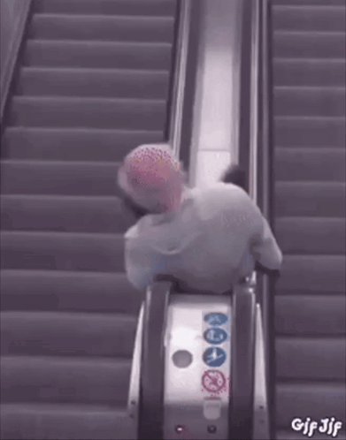A Gif Of A Person Riding An Escalator With The Words Gif Jjf On The Bottom GIF