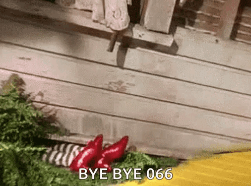 A Gif Of A Person Saying Bye Bye 666 In Front Of A Wooden Building GIF