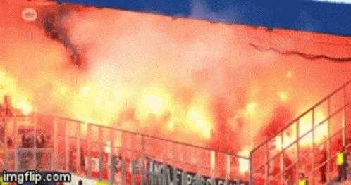 A Gif Of A Stadium With Flames Coming Out Of The Stands Is Being Displayed On Imgflip.com GIF