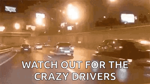 A Gif Of Cars Driving Down A Highway At Night With The Words Watch Out For The Crazy Drivers GIF