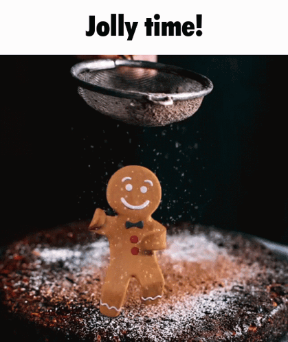 A Gingerbread Man Is Being Sprinkled With Powdered Sugar On A Cake GIF