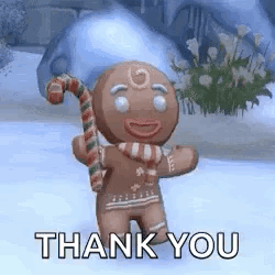 A Gingerbread Man Is Holding A Candy Cane In The Snow And Saying Thank You . GIF
