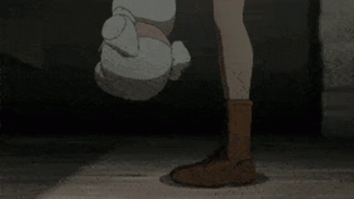 A Girl And A Boy Are Standing Next To Each Other In Front Of A Brick Building . GIF