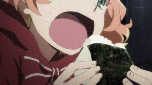 A Girl Eating A Sandwich With Tokyo Mx 1 Written On The Bottom GIF