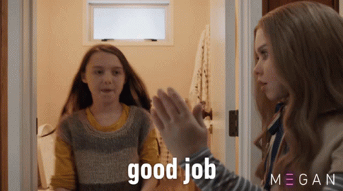 A Girl Giving Another Girl A High Five With The Words Good Job Behind Her GIF