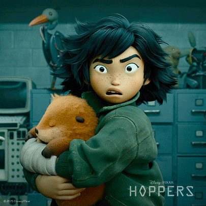 a girl holding a stuffed animal with the word hoppers on the bottom