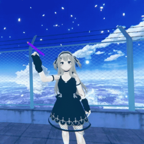 A Girl In A Black Dress Is Standing In Front Of A Chain Link Fence GIF
