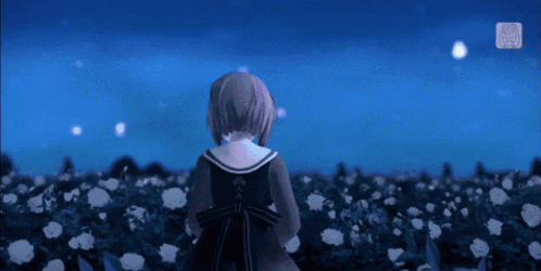 A Girl In A Black Dress Stands In A Field Of Flowers GIF