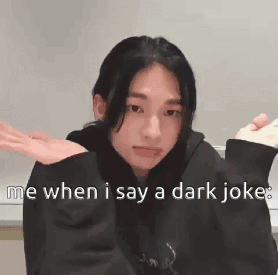 A Girl In A Black Hoodie Is Making A Funny Face While Holding A Remote Control . GIF