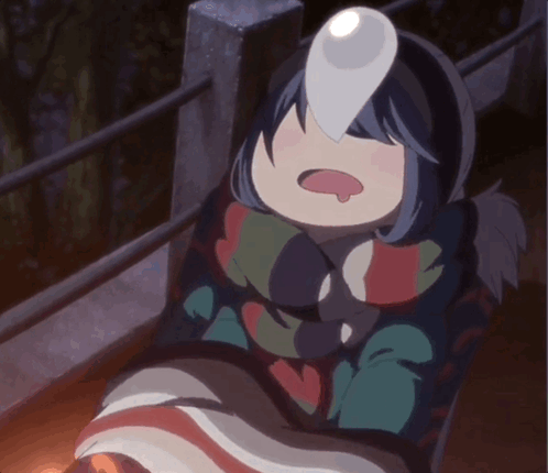 A Girl In A Blanket With A Light On Her Face GIF