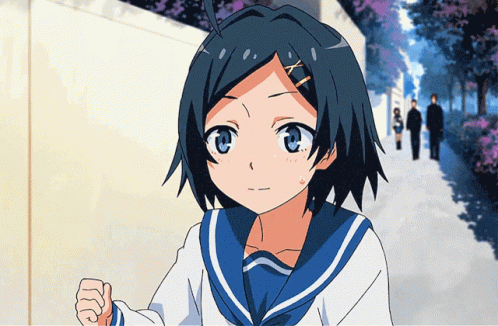 A Girl In A Blue And White Sailor Uniform Stands In Front Of A Fence GIF